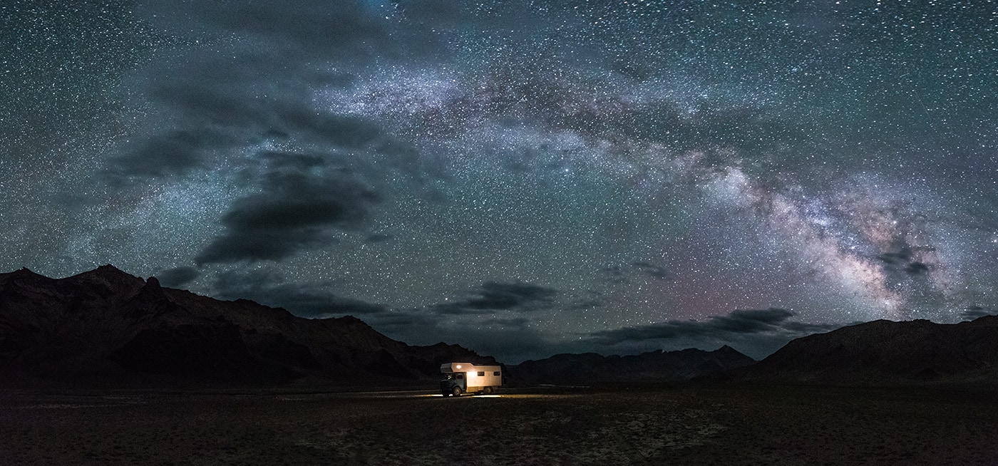 Camping Truck In Remote Tajik Mountain Landscape Under The Milky Way