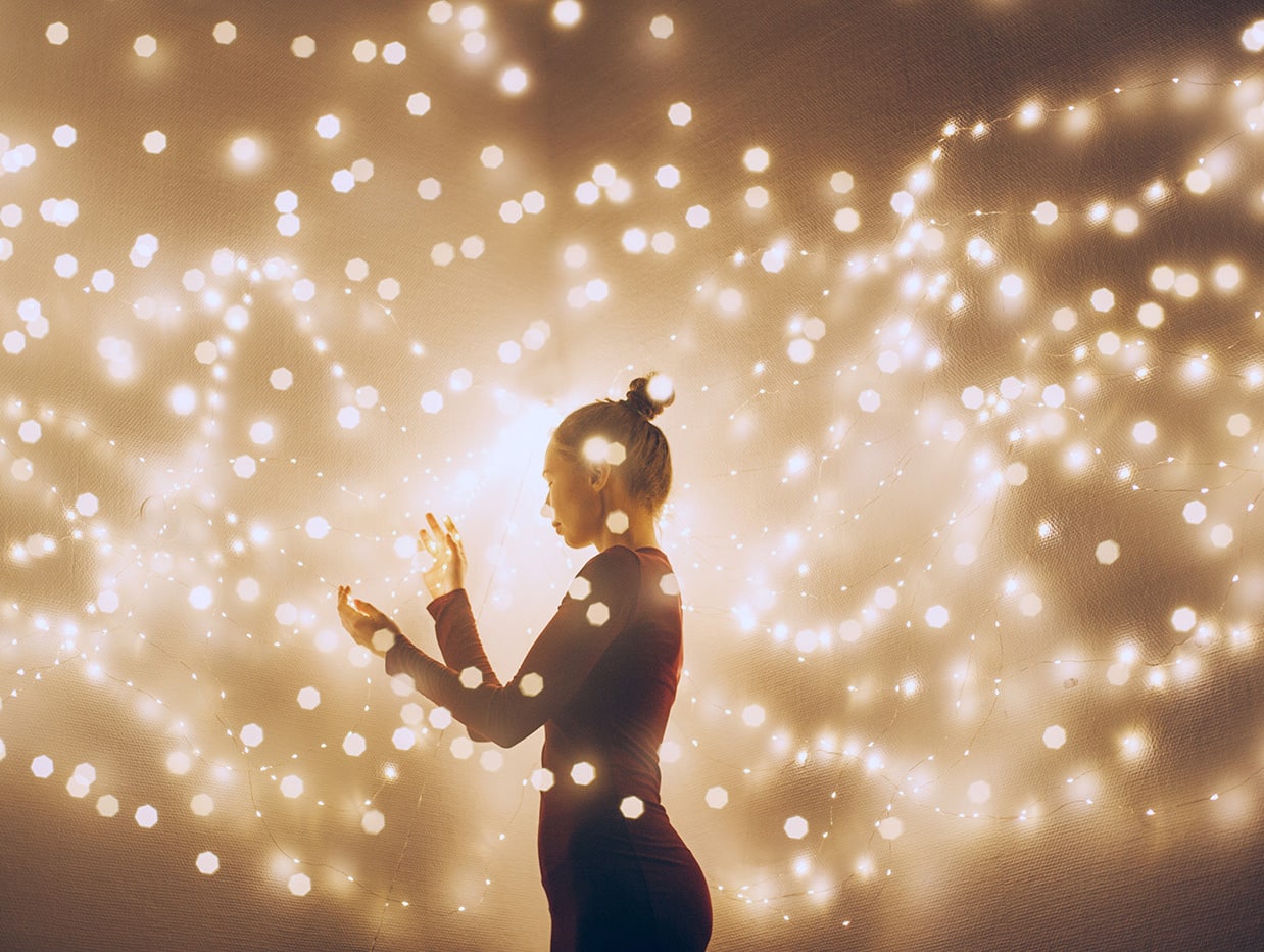 Creative Image Of A Woman Surrounded By Light. Double Exposure Shot.
