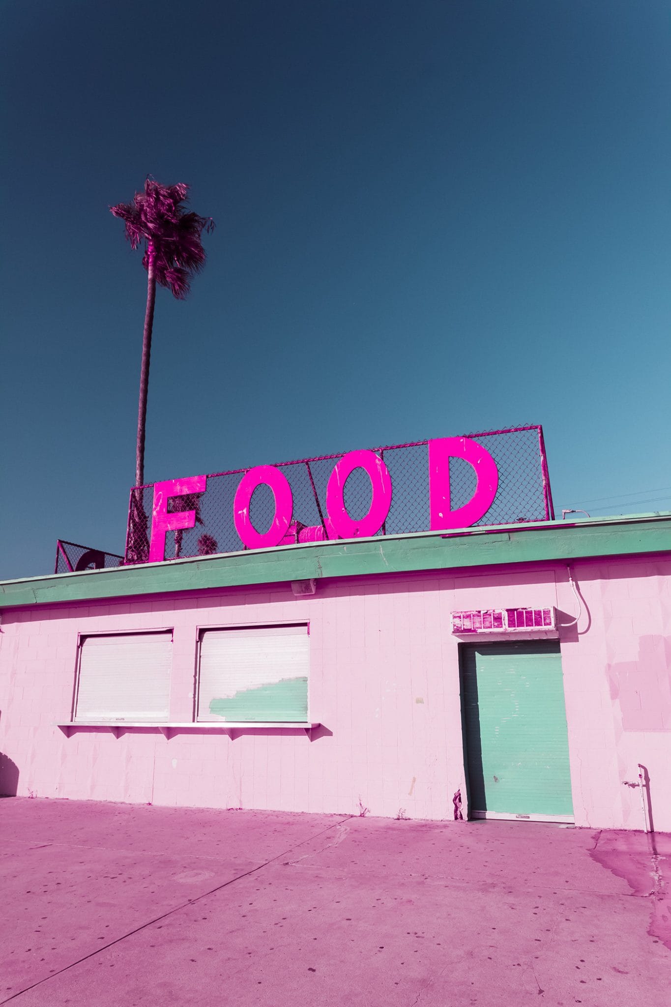 Pink Food Sign On Top Of Building At Santa Monica Beach