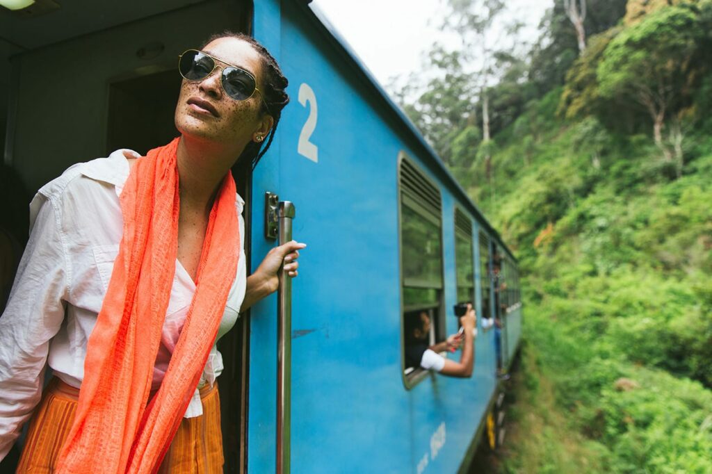 Travel photography Woman Leaning Out Of A Train In The Countryside