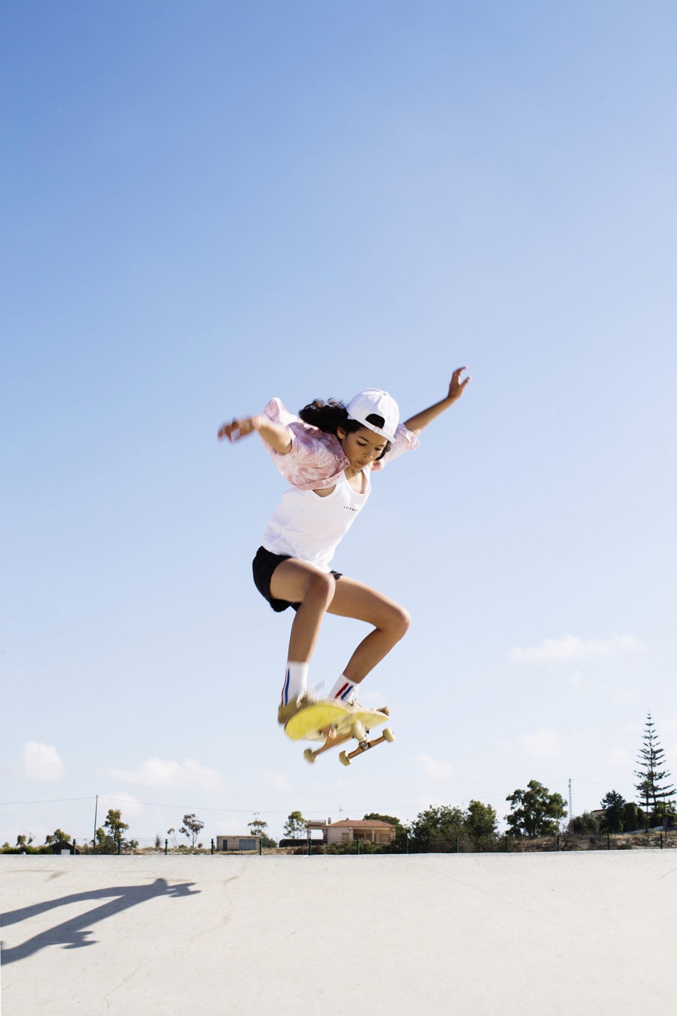 Teen-Girl Make An Ollie On A Skateboard