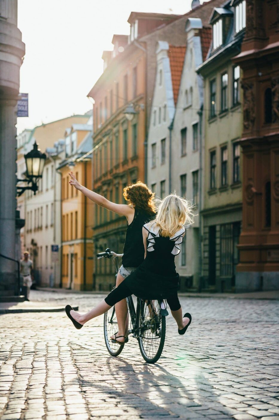 Girlfriends Havin Fun Around The City With Bicycle