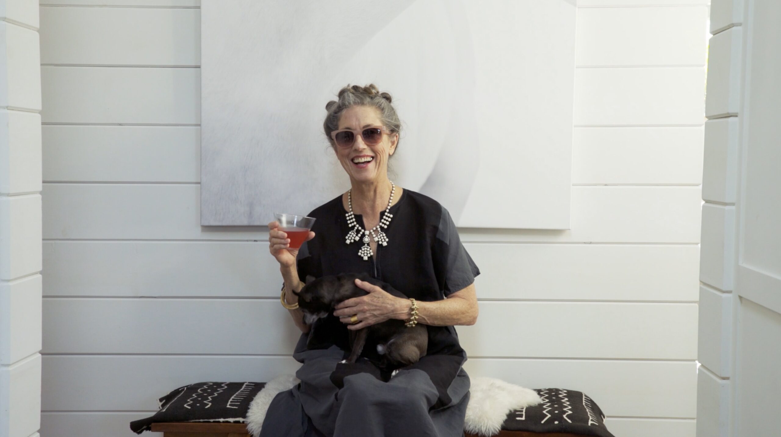 Portrait Of Stylish Senior Woman With Grey Hair At Home With Her Dog