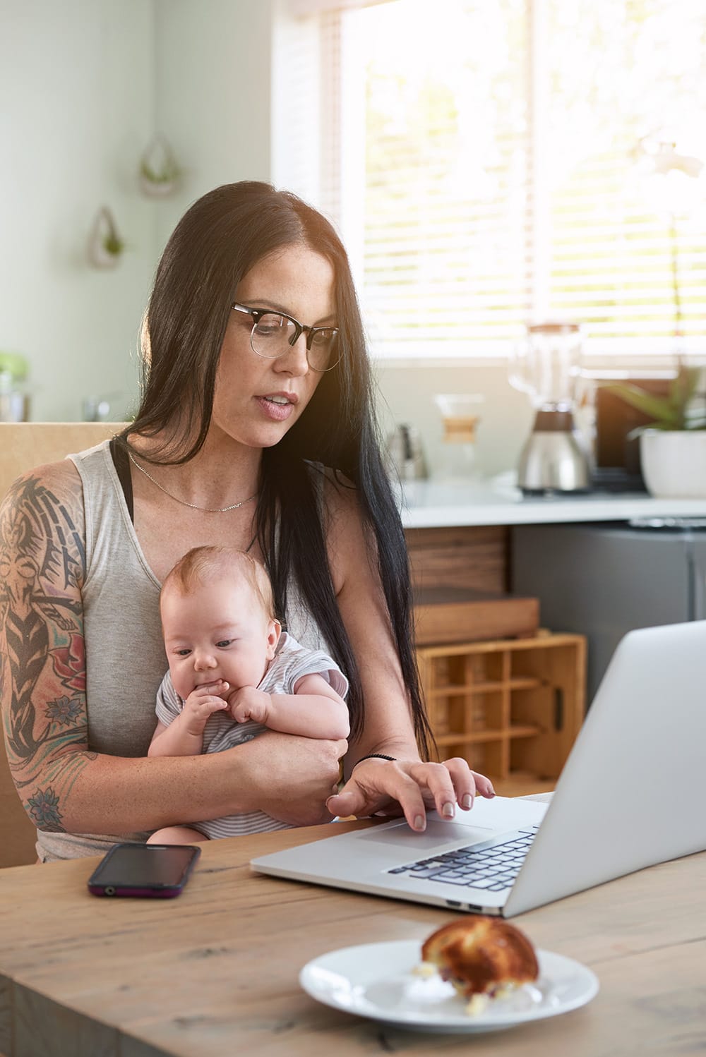 Mother Working From Home With Baby