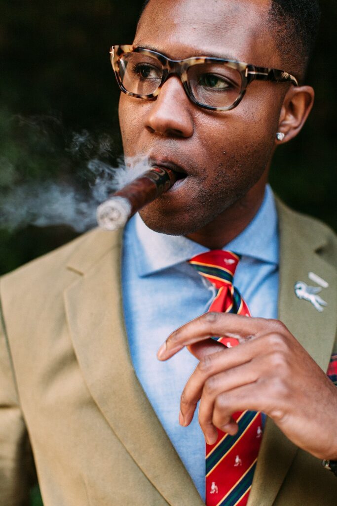 Business Man Smoking A Lit Cigar