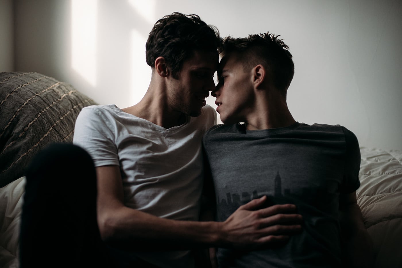 Young Gay Couple In Bedroom