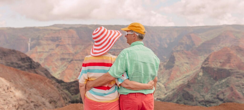 A couple poses above Waimea Canyon in Kauai Above Waimea Canyon.