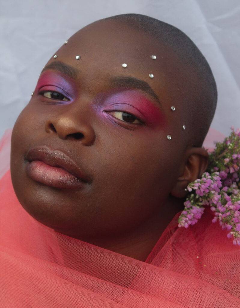 Ebony On Lavender Black woman in colourful makeup
