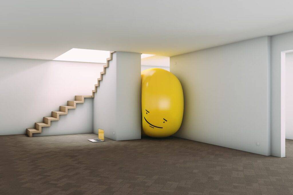 Privacy Concept With A Yellow Balloon Yellow balloon with a face trapped between walls spying on a laptop inside a house. Privacy concept