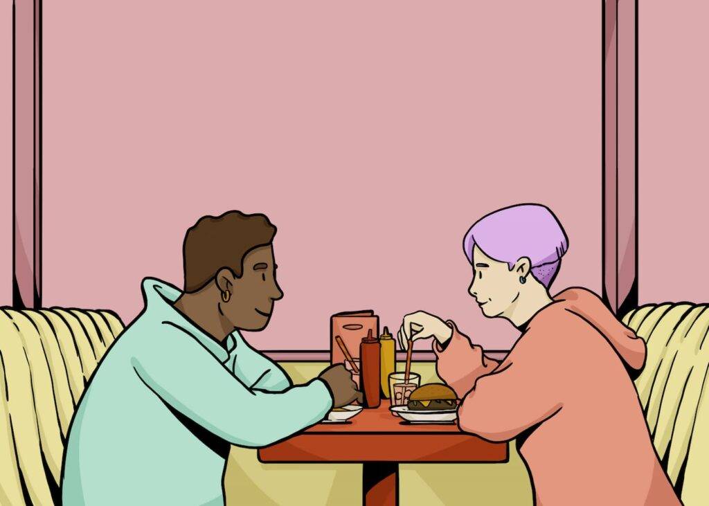 Multiracial boyfriend and girlfriend in casual clothes looking at each other while having romantic dinner in fast food restaurant.