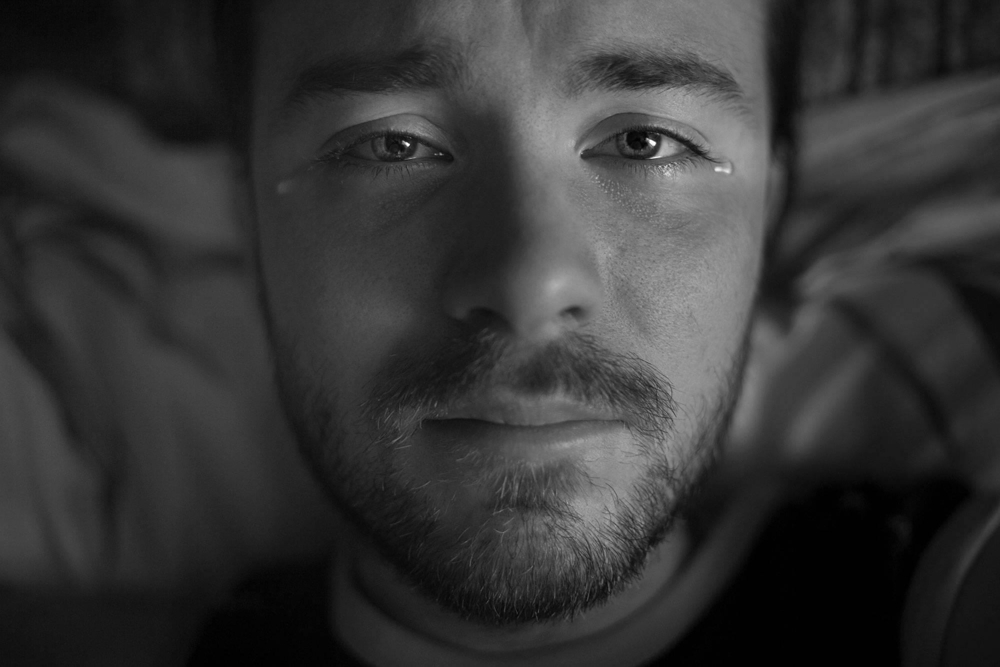 Portrait Of A Man With A Beard Crying At The Camera In Tears With Beautiful Eyes