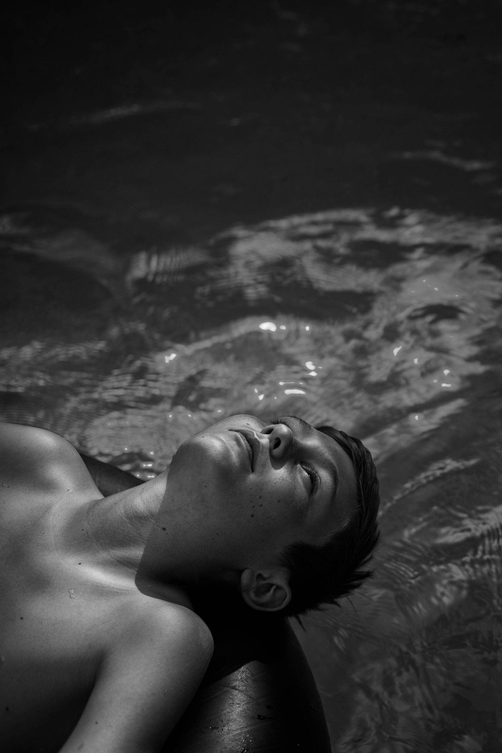 Teen Boy On Innertube In A Pool