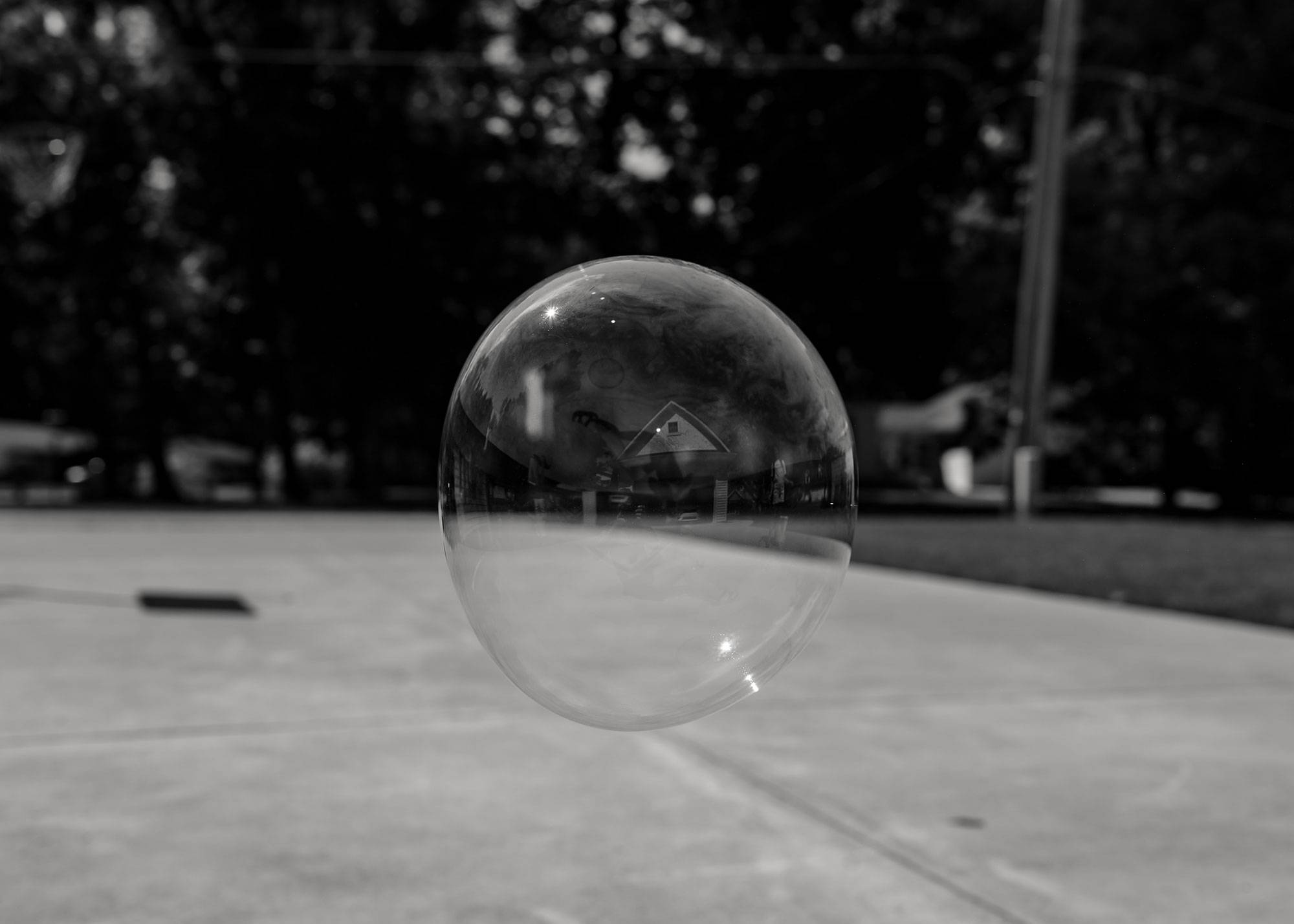 Giant Bubble Showing Reflection Of A House