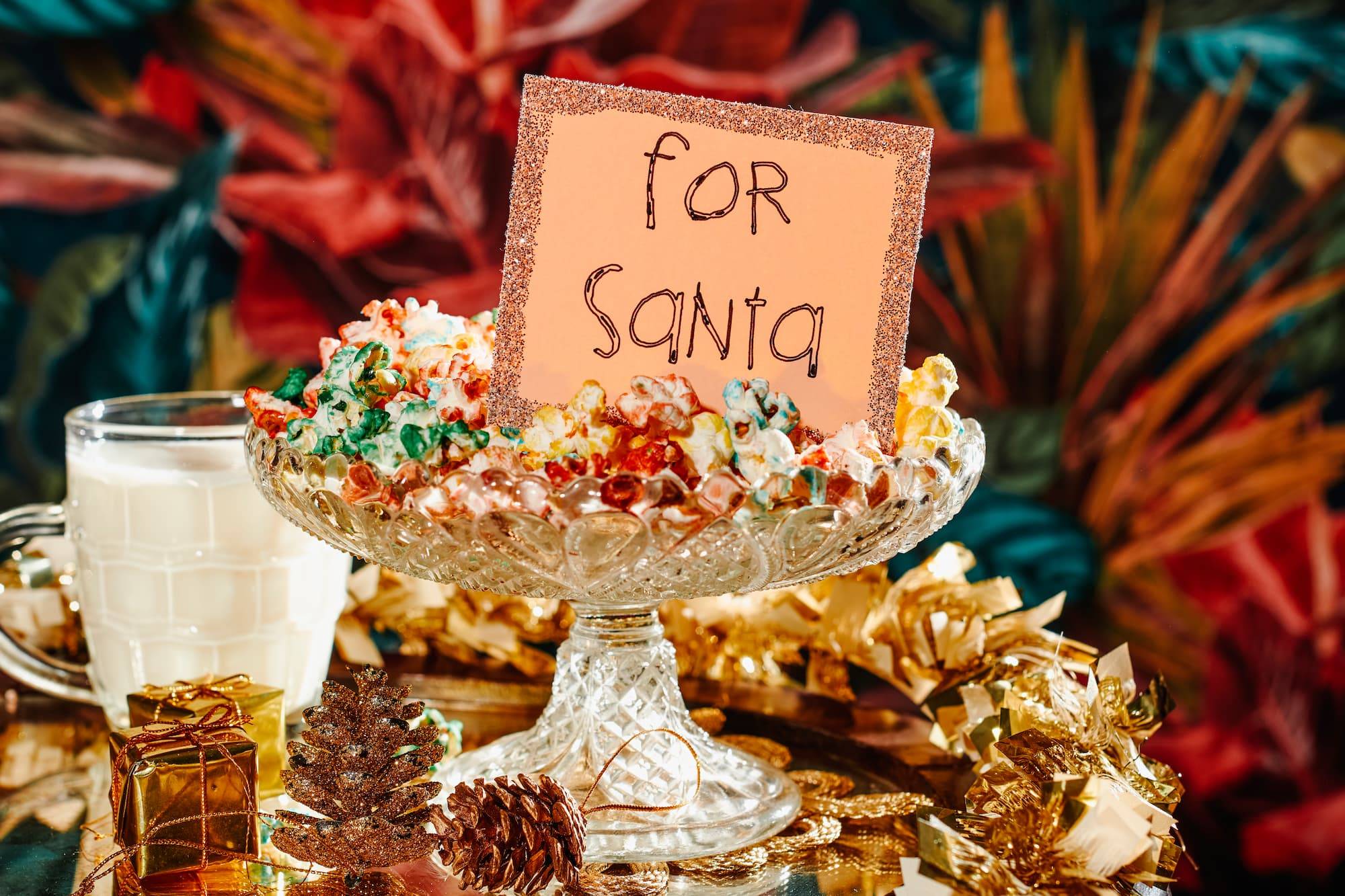 Food And A Note For Santa On A Table Ornamented With Golden Tinsel