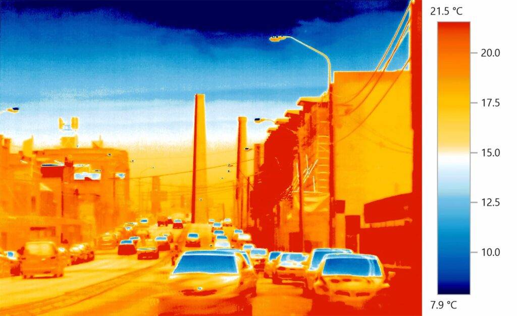 Vehicles on a suburban street. IR Infra-red thermal imaging camera recording thermographic images for climate change / global warming scientific analysis revealing urban heat radiation. Sydney city, Australia.