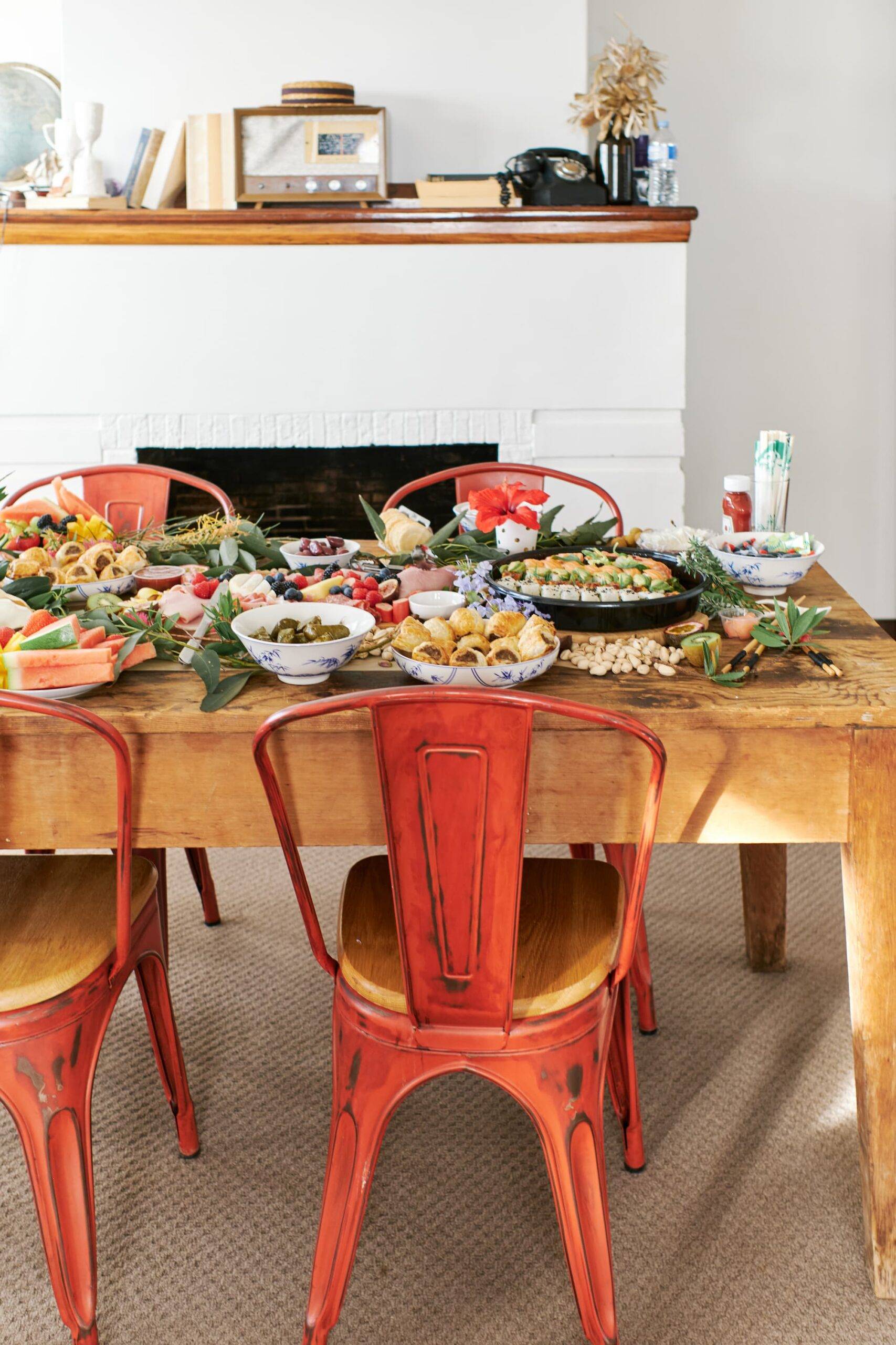 a grazing table of delicious food for a party set in an aesthetic room