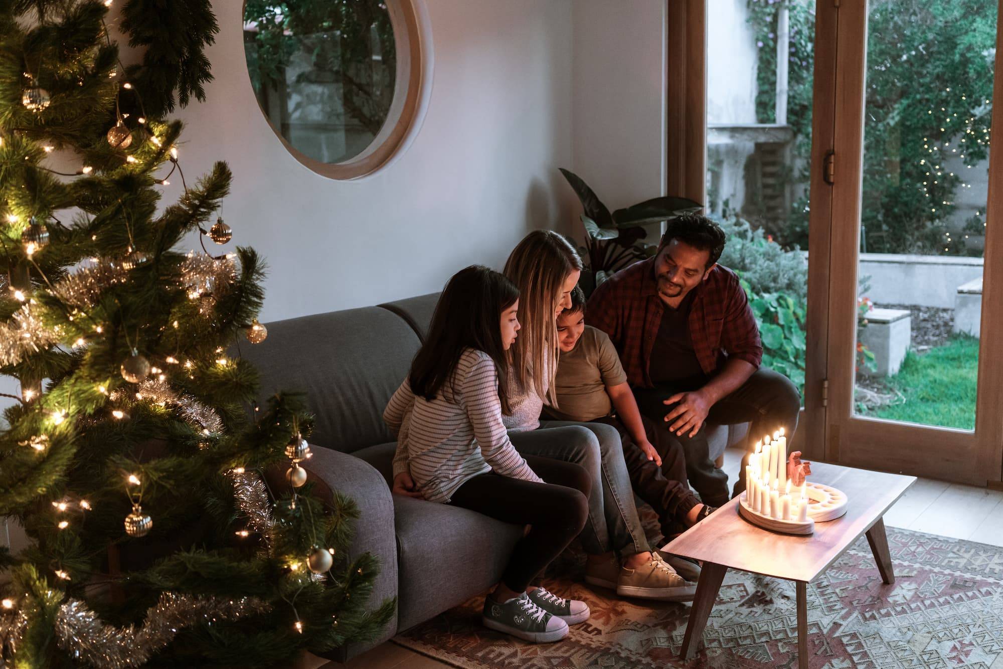 A family light advent candles together and learn about the meaning of Christmas