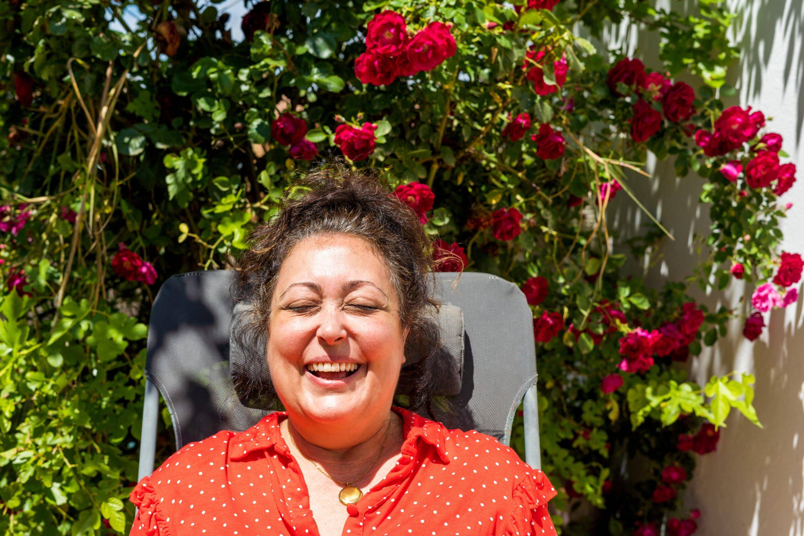 Joyful Mature Woman Laughing For A Selfie At Garden