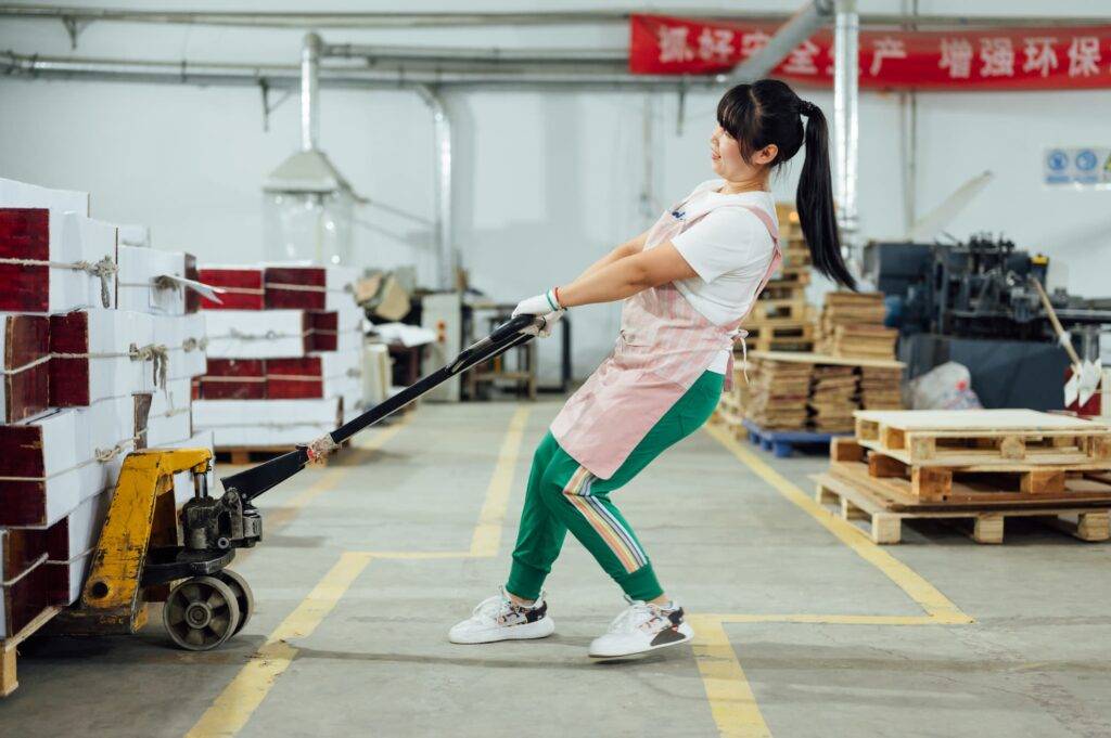 Portrait of Asian female factory worker working in the printing factory.