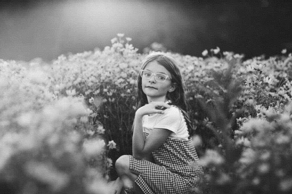 Preteen Smiles At Camera In Wildflower Field