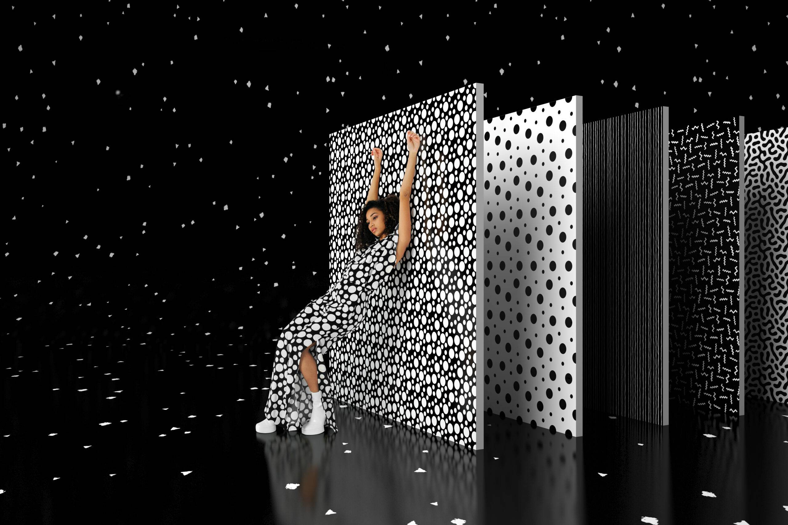 Portrait of a fashion modern black woman posing on a digitally created set of patterned walls with stripes and dots