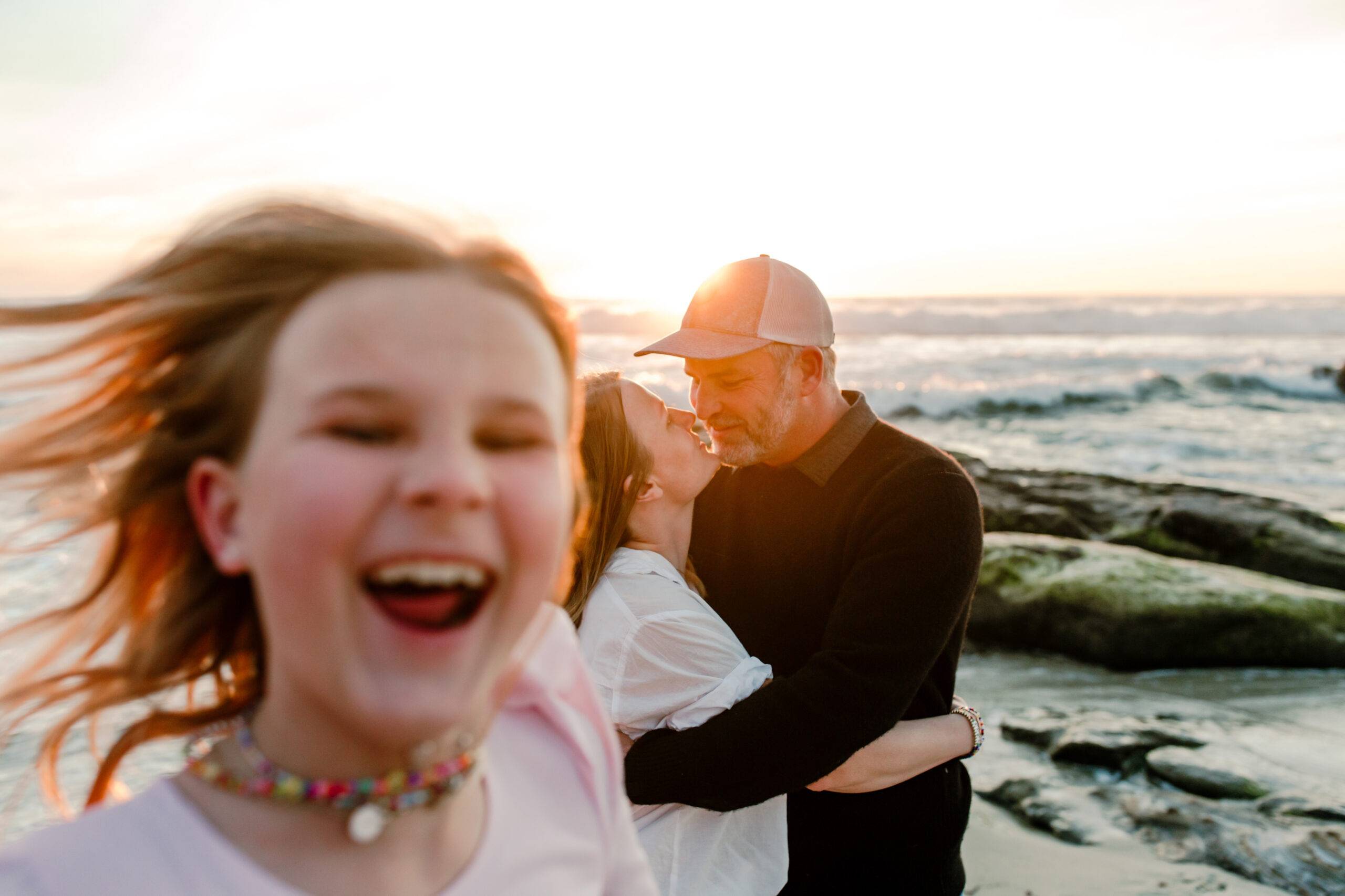 Photobombing Her Parents Funny moment of daughter photobombing her parents. They are at a beach in california and looking happy together.