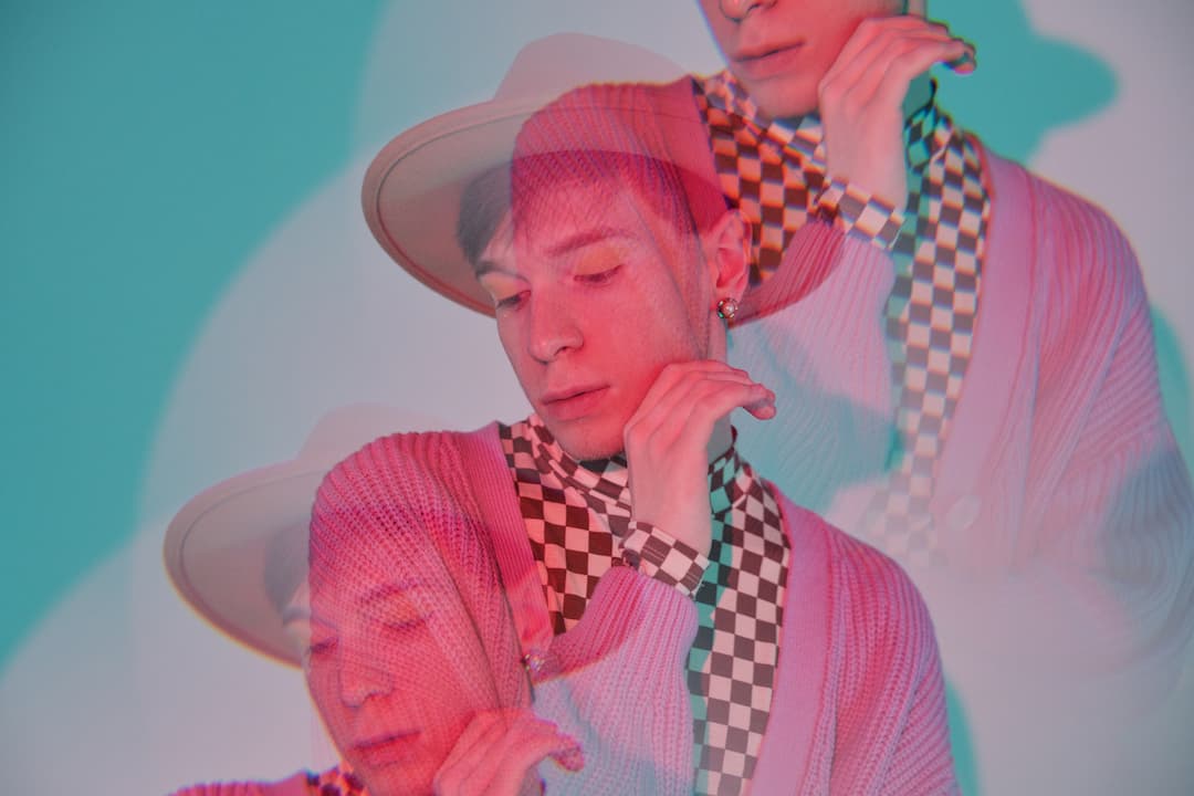 https://www.stocksy.com/photo/4674662/young-queer-man-in-hat-repeating-image