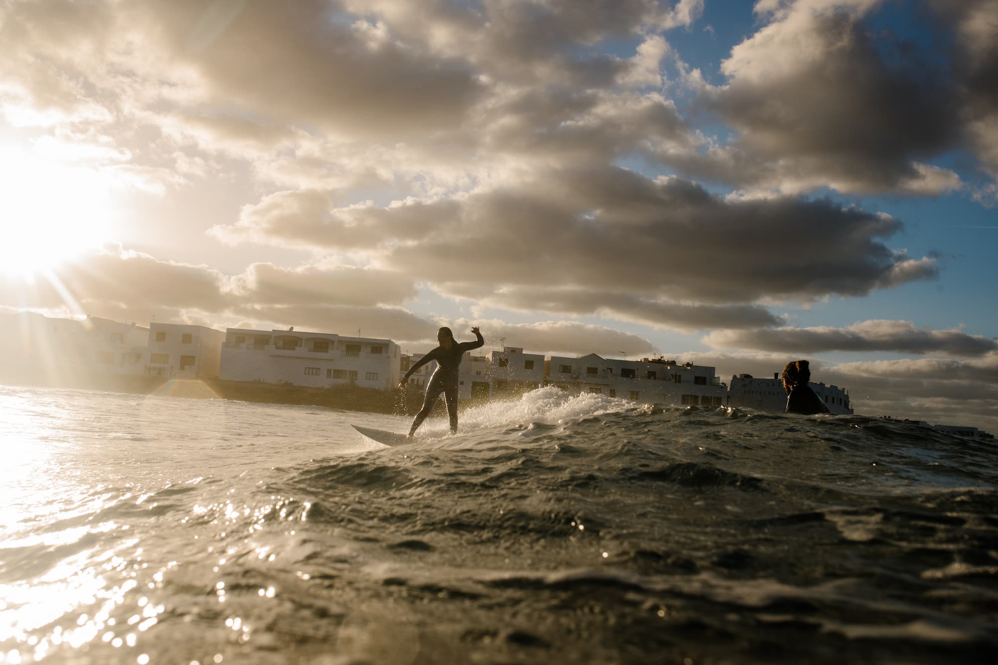 Female surfers enjoy an afternoon of practice in the waves