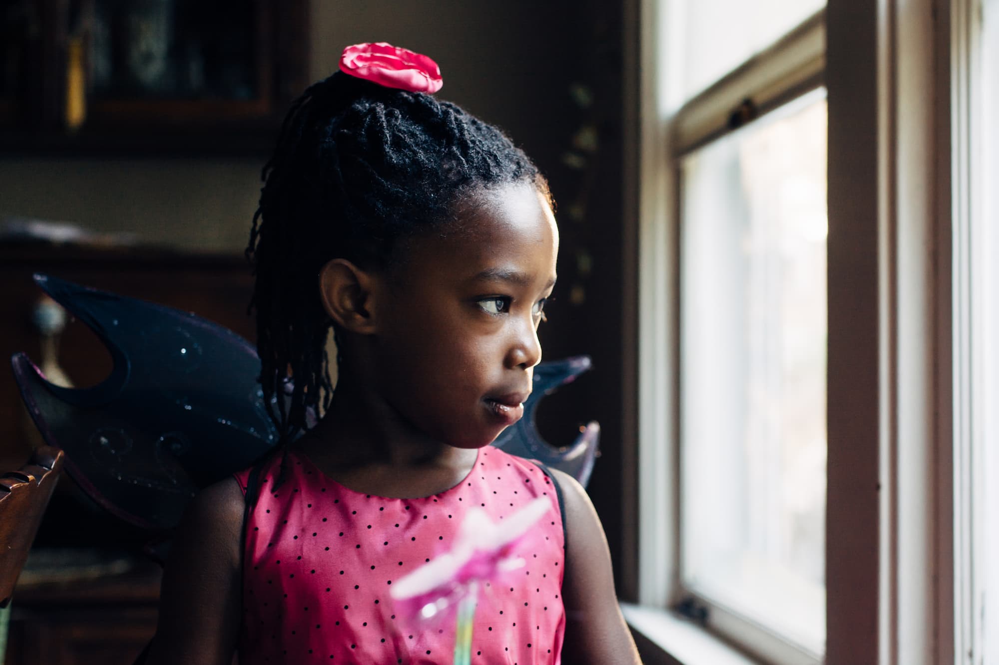Cute black girl in pink fairy dress