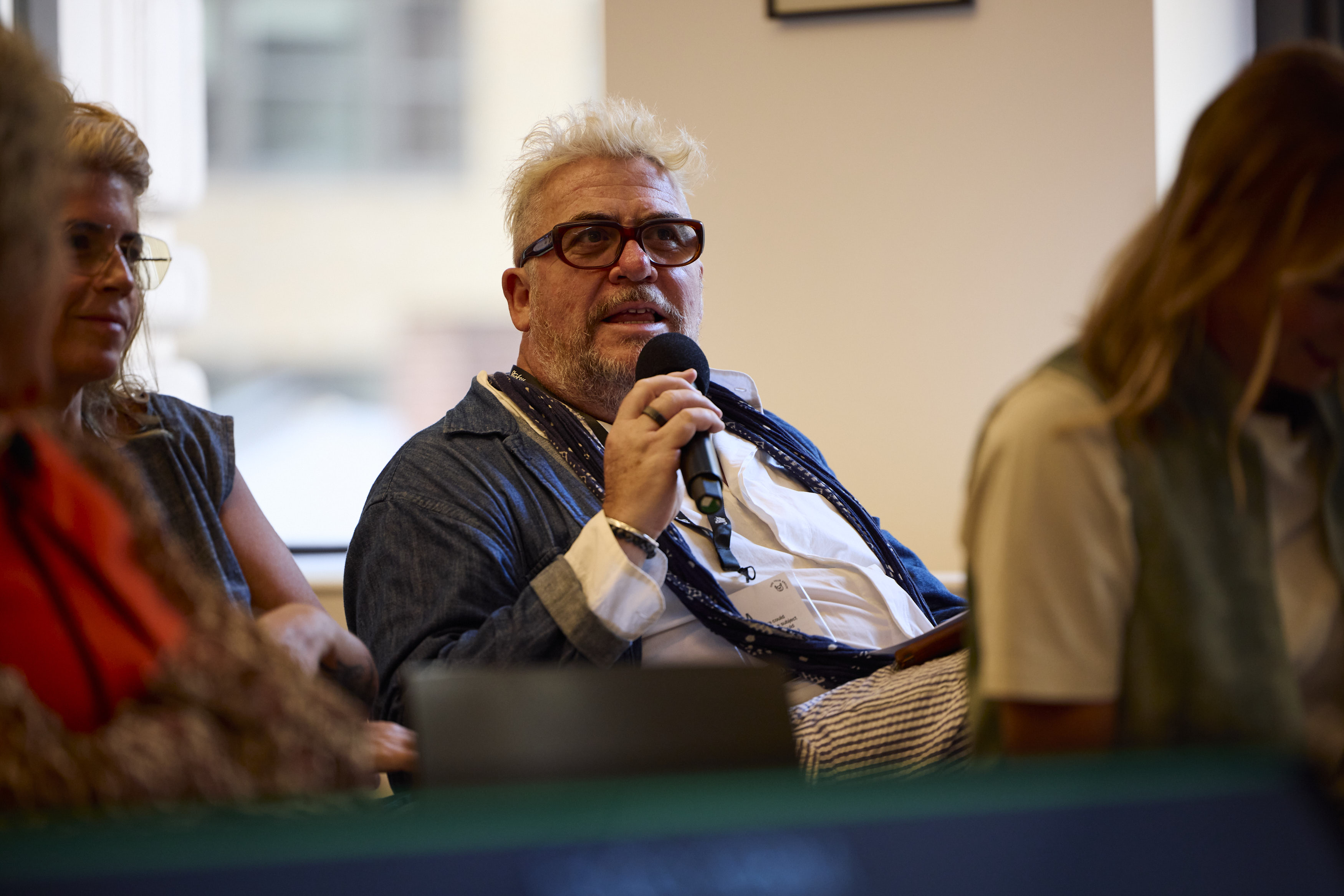 Audience member speaking at Stocksy's Signs of Life event.