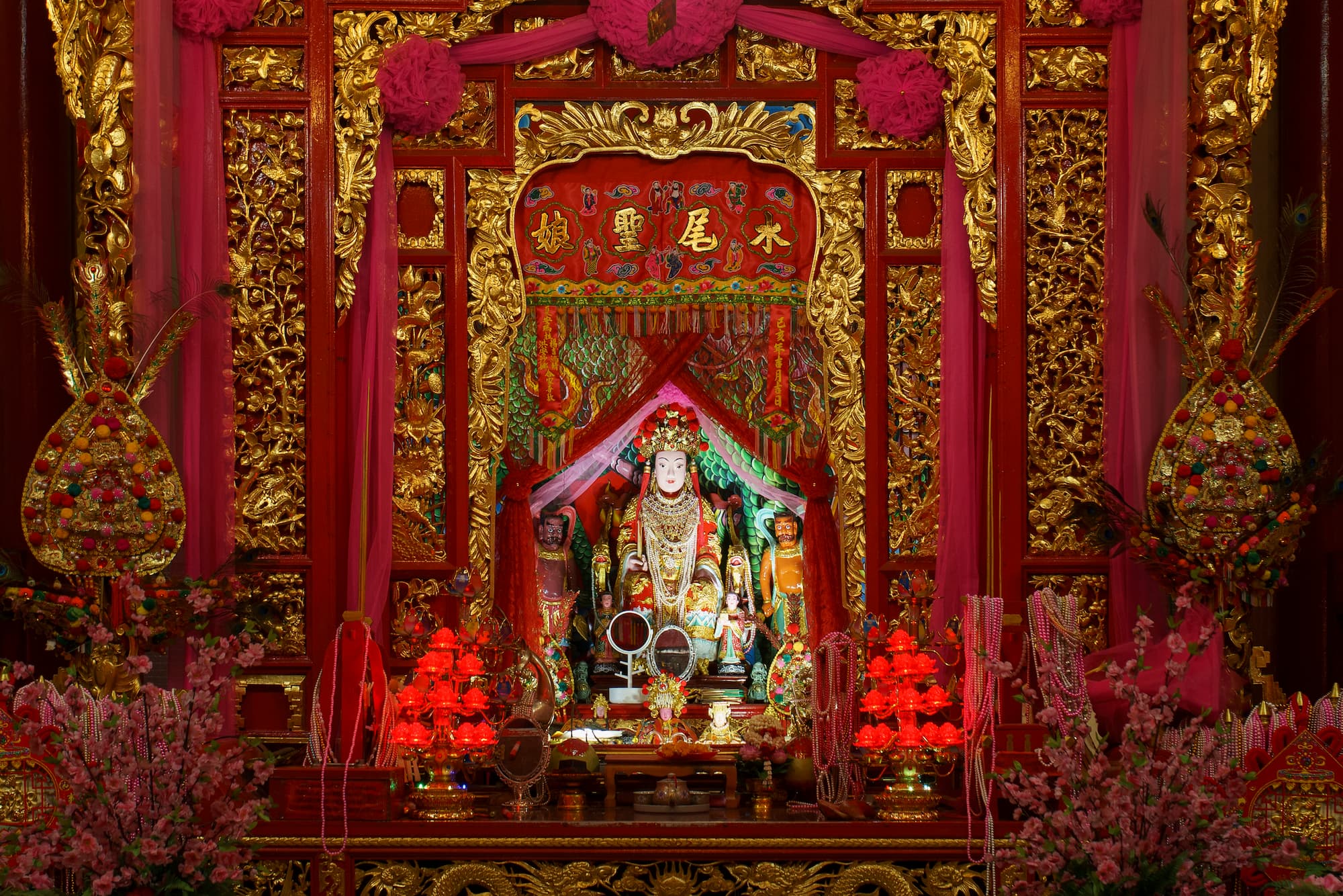 The statue of "Chao Mae Thab Thim" (Goddess Thab Thim) which represents the deity of local Thai-Chinese people's belief inside a traditional Chinese shrine at Sam Sen, Bangkok